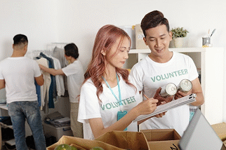 Volunteers packing food boxes during CSR initiative