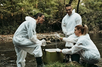 Team performing environmental water cleanup initiative