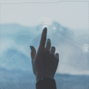 Hand pointing at digital transformation city visualization