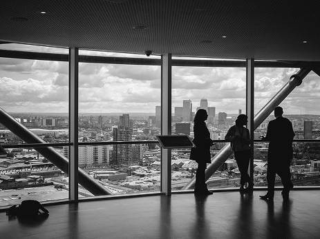 People discussing inside modern representing global office