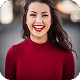 Portrait of smiling woman in red top
