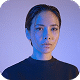Studio portrait of woman with blue dramatic lighting